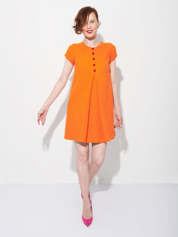 baby doll orange dress with buttons walking • Sassa Björg