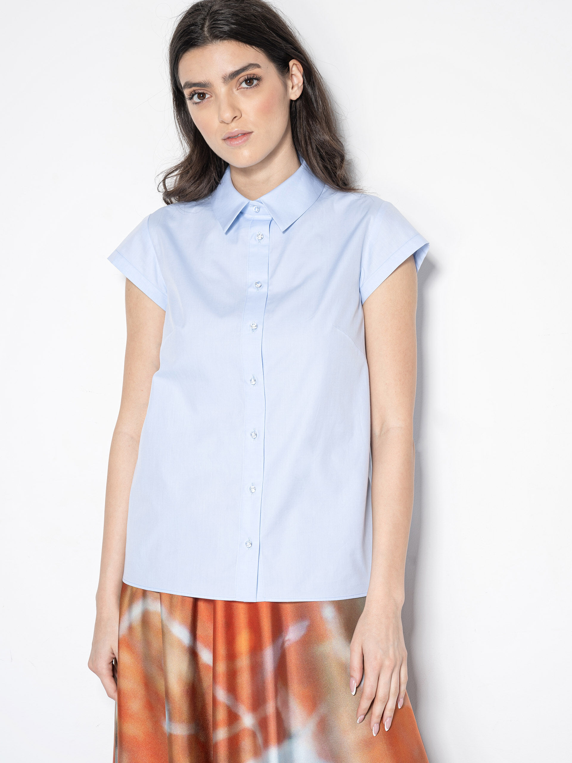 light blue shirt w exaggerated bow without the bow • Sassa Björg